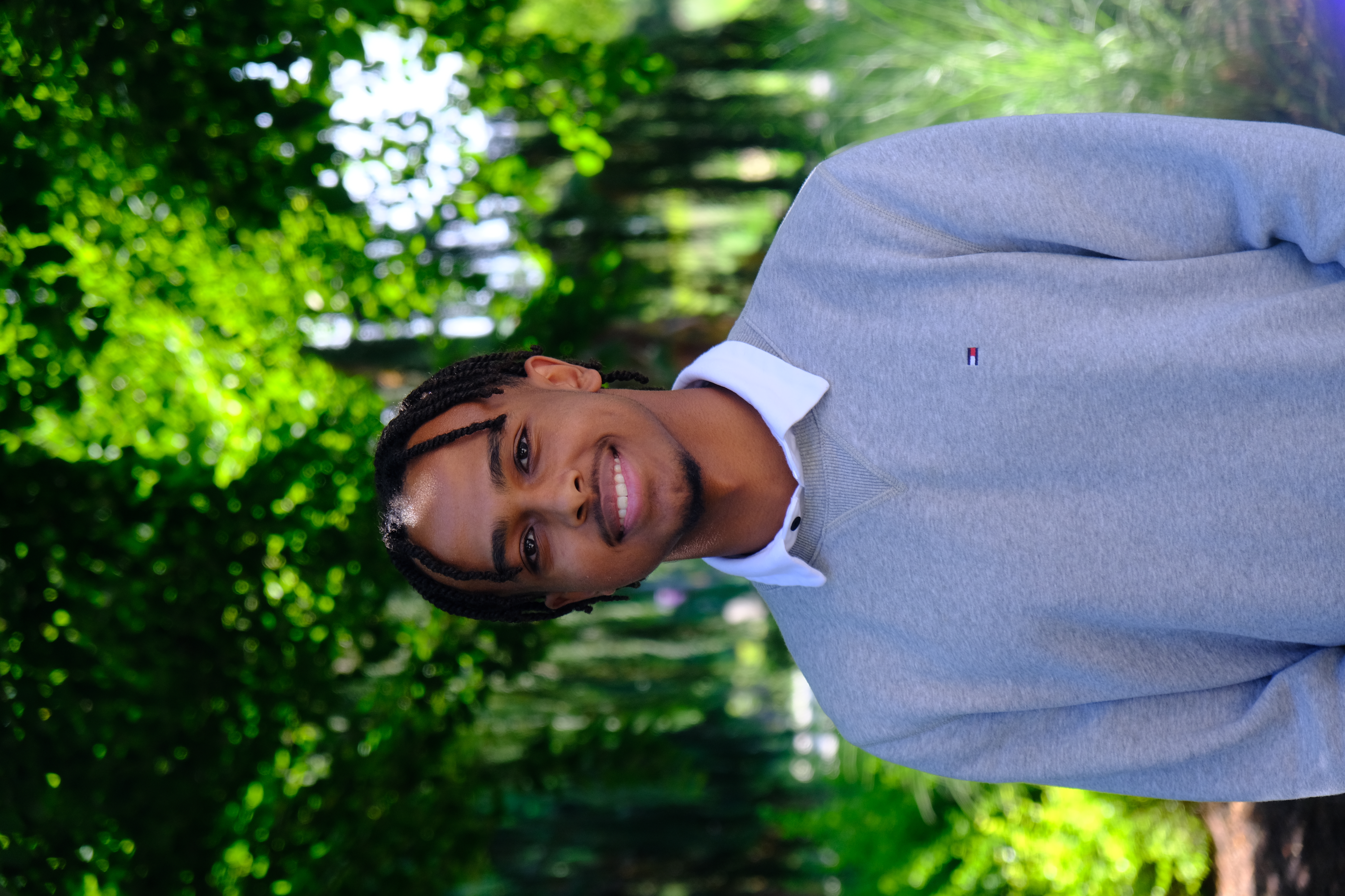 Daniel smiling with a thumbs up